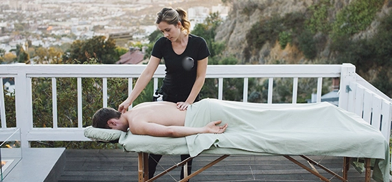 Therapist Performing Outdoor Swedish Massage Downey CA on Male Client