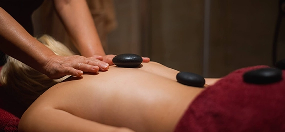 Hot Stone Massage Therapy Session in Progress