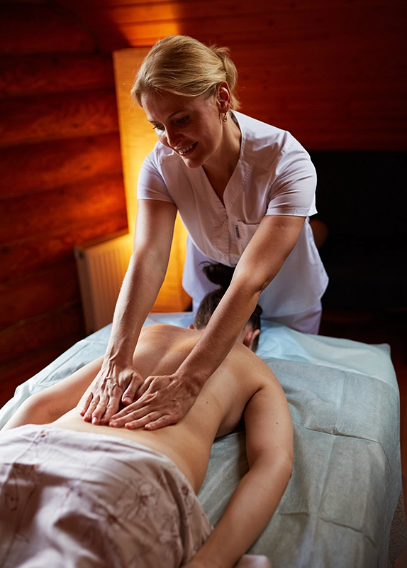 Massage Therapist Performing Swedish Massage in Downey CA Spa Setting