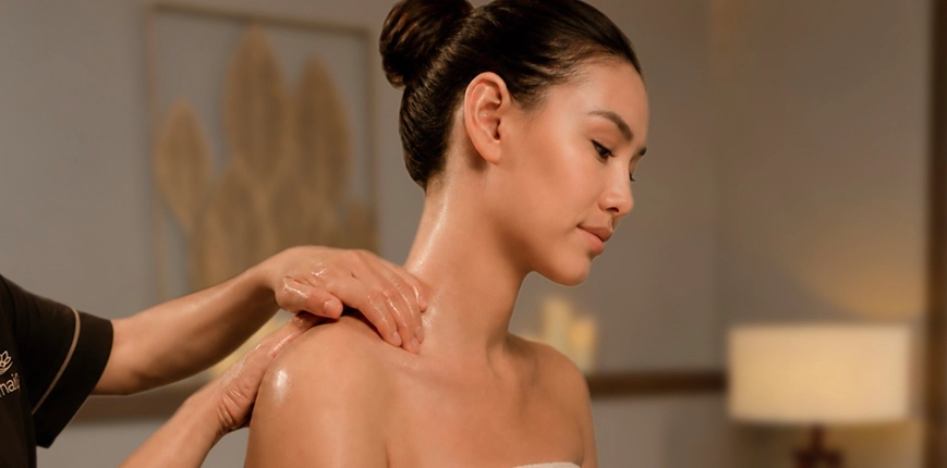 Woman Receiving Shoulder Massage in a Spa Setting