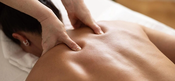 Therapist Performing Deep Tissue Massage on Client's Upper Back